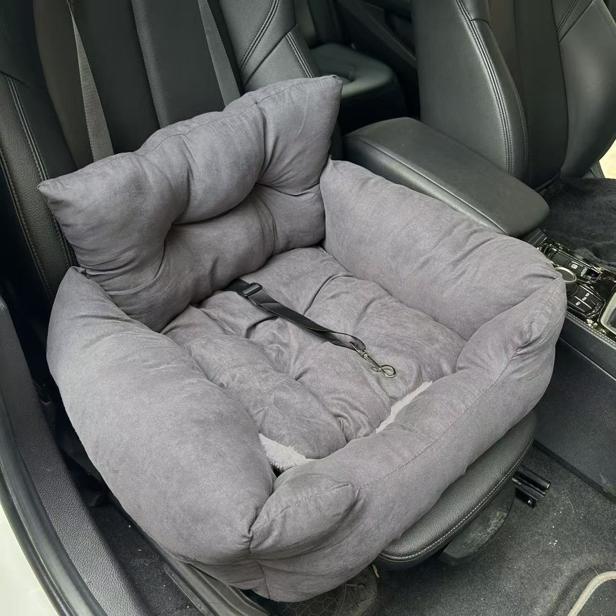 Gray pet bed inside a car seat
