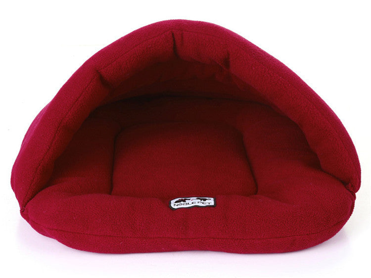 Red pet bed with a visible brand label on a white background