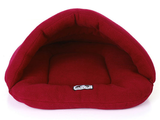 Red pet bed with a visible brand label on a white background